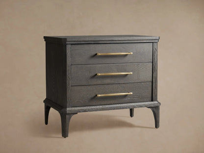 St. Martin Closed Nightstand in dark wood finish, features three drawers with brass-finished handles, and tapered legs, shown on a neutral background.