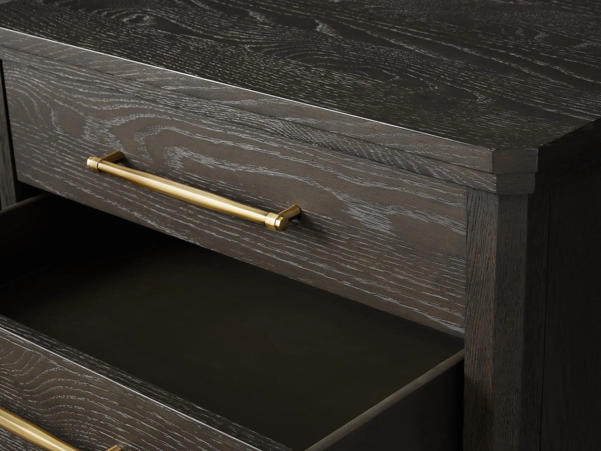 St. Martin Closed Nightstand shown in dark oak finish with three drawers. Brass-finished handles complement its craftsman design.
