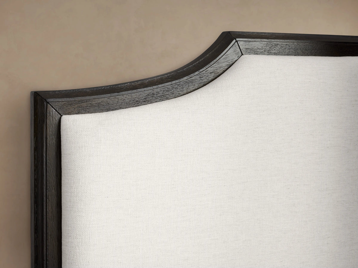 St. Martin Bed in dark oak finish with white upholstered headboard, made with clean lines and elegant design, queen size.