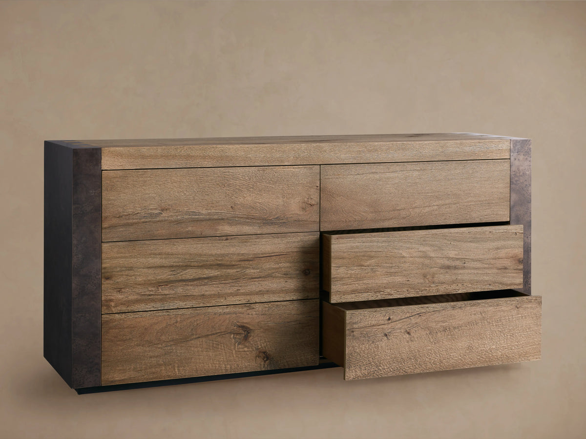 Telluride Six-Drawer Dresser corner detail with weathered steel edge and open oak wood drawer, showing textured finish.