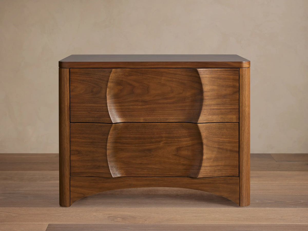 Dark walnut Westyn Nightstand with two drawers, featuring a unique carved wavy design across the drawer fronts.