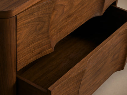 Dark walnut Westyn Nightstand with two drawers, featuring a unique carved wavy design across the drawer fronts.
