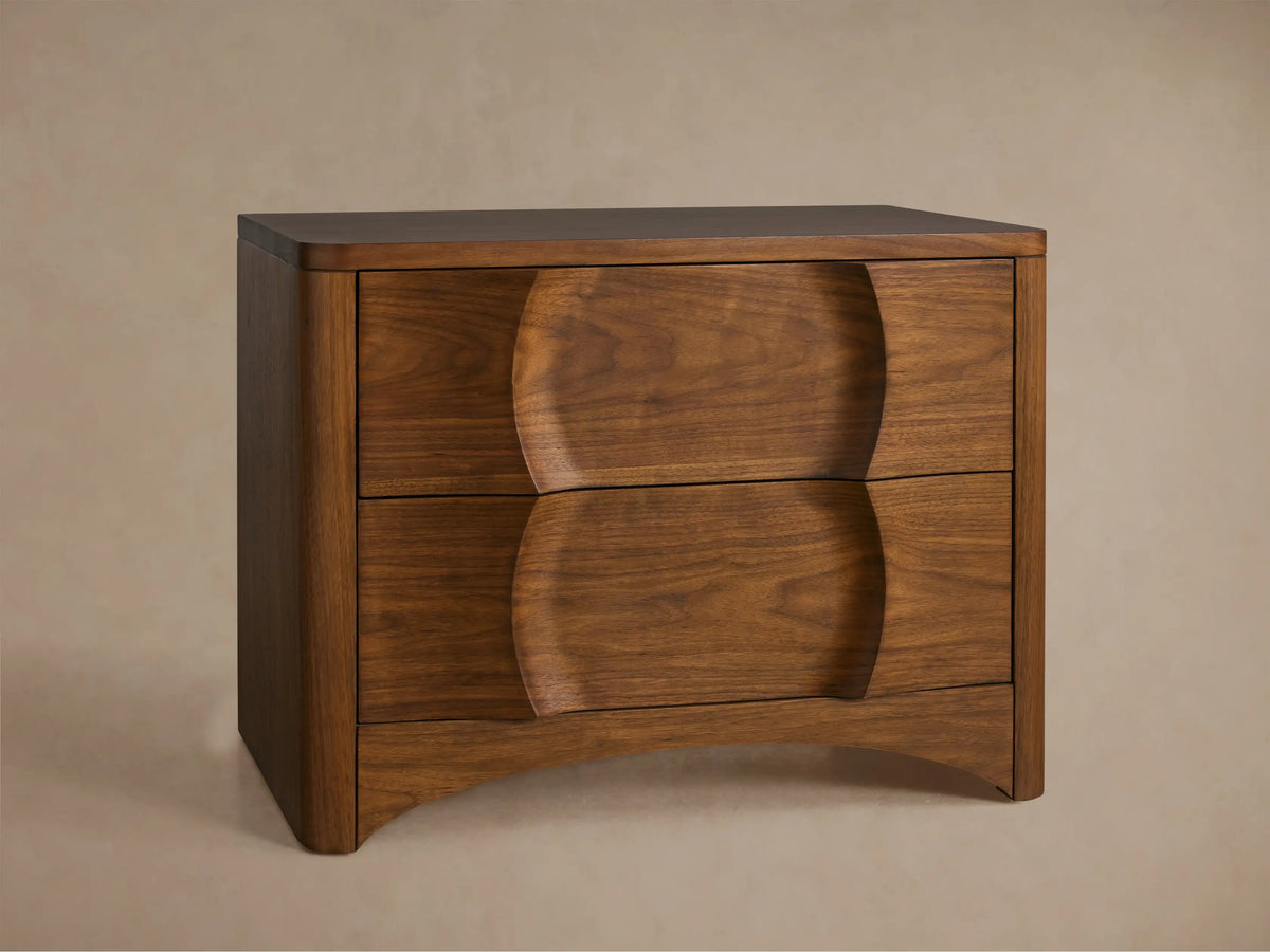 Westyn Nightstand, dark brown walnut veneer. Close-up shows top drawer slightly open, revealing unique carved detail.