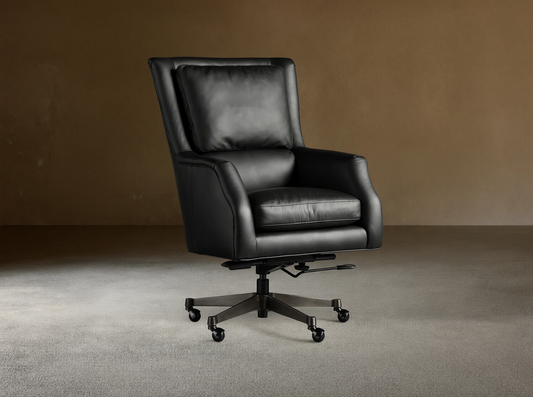 Alex Leather Desk Chair in black leather upholstery on casters, with adjustable armrests and backrest, set on a wooden floor.