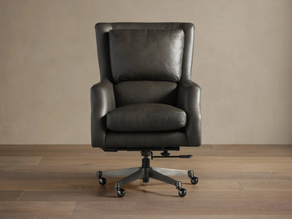Alex Leather Desk Chair, dark gray leather, high back with cushion, armrests, 5-star swivel base with casters, angled.