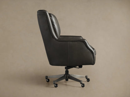 Close-up of Alex Leather Desk Chair in dark grey, featuring soft leather armrest with silver piping, seat, and cushioned back.