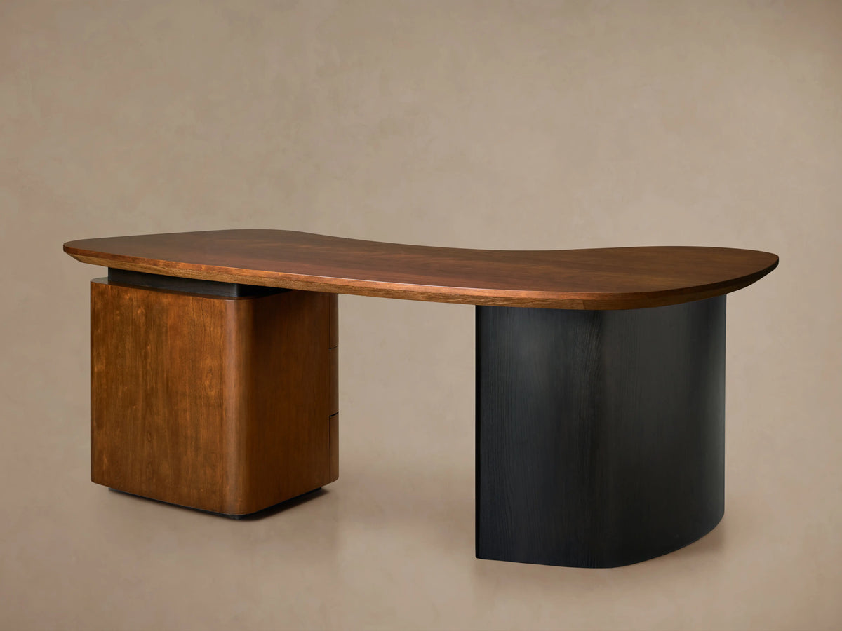 Berkley Executive Desk with a cherry wood top, curved design, inset handles, oak legs finished in ebony.