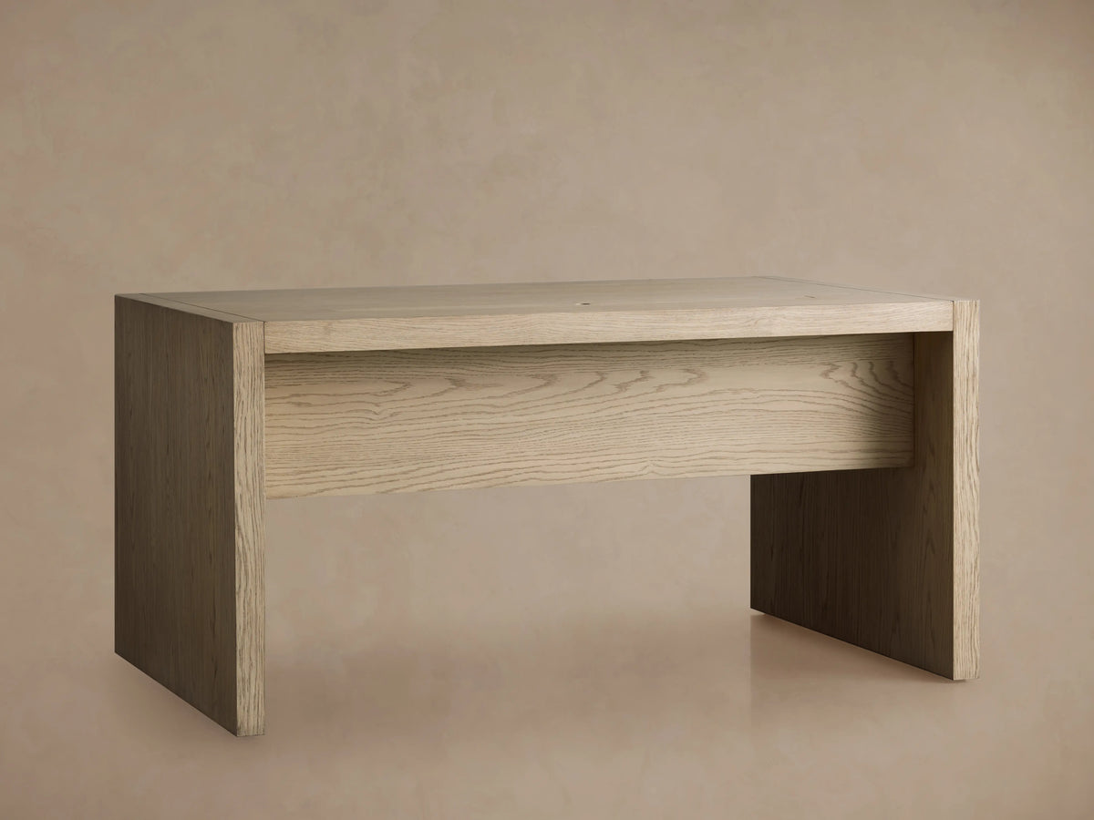 Bodhi Modular Desk made of solid white oak and veneers, featuring a rectangular design and wire-brushed finish on a beige background.