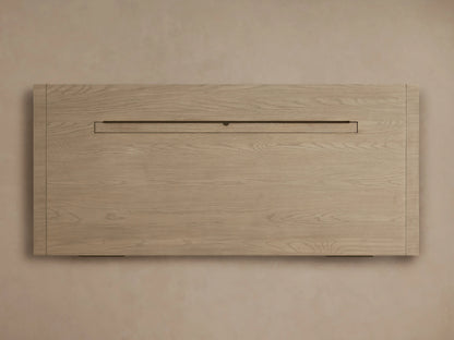 Front view of Bodhi Executive Desk crafted from light, wire-brushed white oak, with a wide, open central storage cubby.