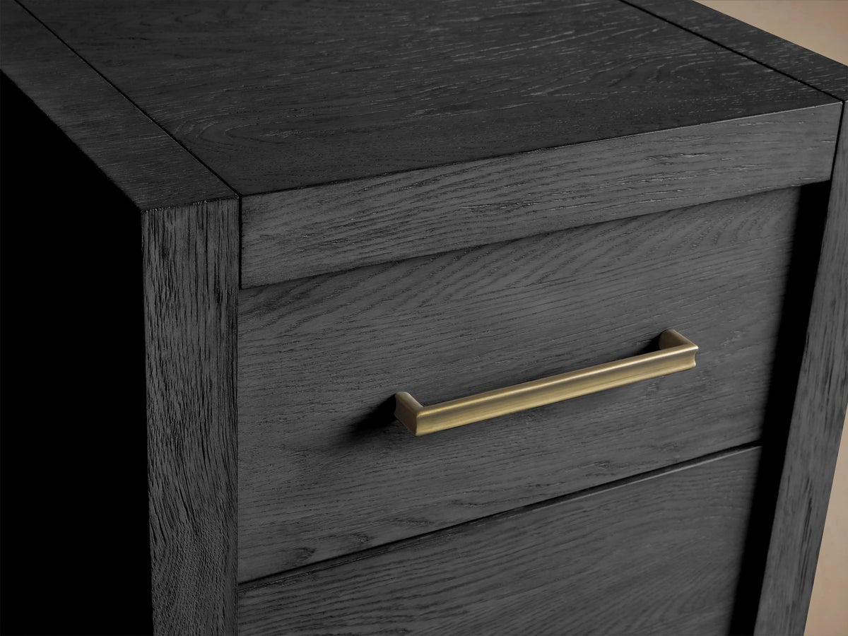 Bodhi Modular File in dark, wire-brushed oak finish with a brass drawer pull. Features visible wood grain and dovetail joinery.