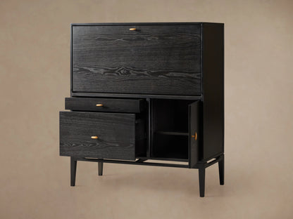 Brock Hideaway Desk made of dark ash wood with open drawers and a door, showing internal shelves on a beige background.