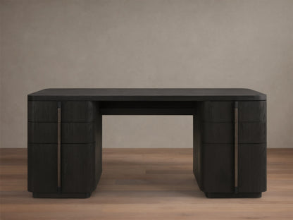 Front view of a dark wood finish writing desk with rounded corners and six drawers featuring long, vertical bronze-toned pulls.