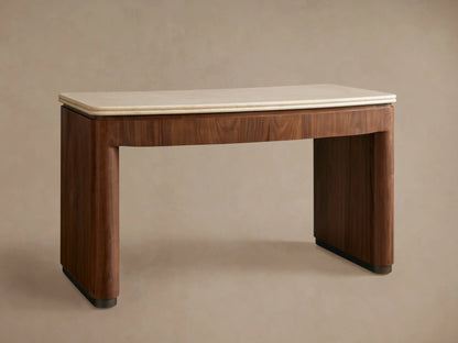 Close-up of Caden Writing Desk with curved walnut base, cream marble top with rounded edges. Drawer slightly open.