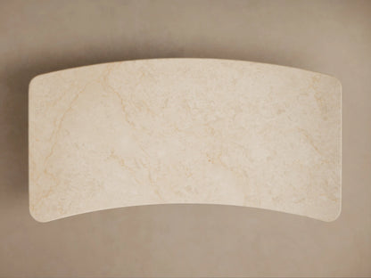 Caden Writing Desk: dark walnut wood with a cream marble top, rounded edges, and curved side panels, front view.