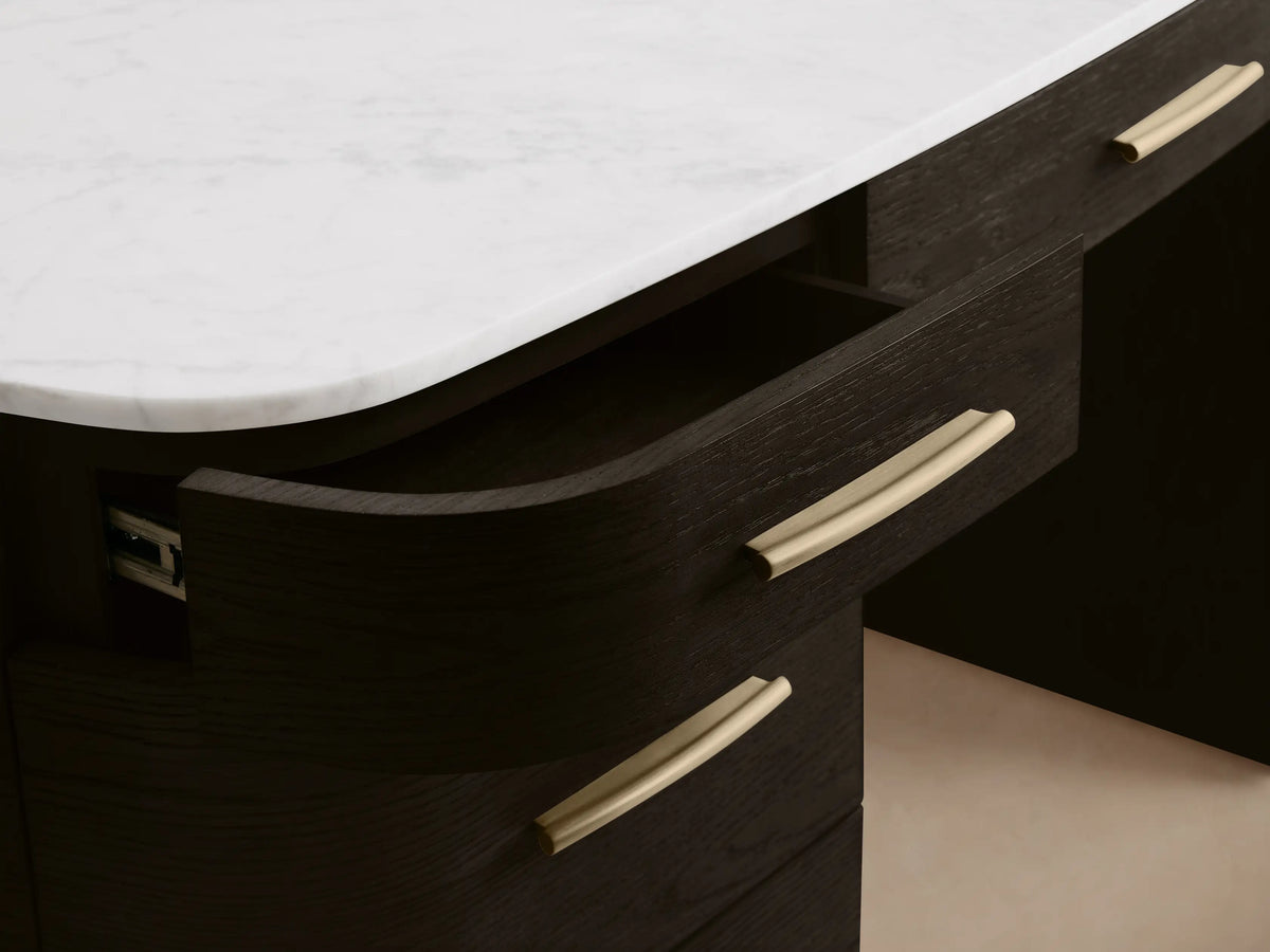 Front view of the dark oak finish Danny Executive Desk‚Ñ¢ with a white Carrara marble top, seven drawers, and brass-colored pulls.