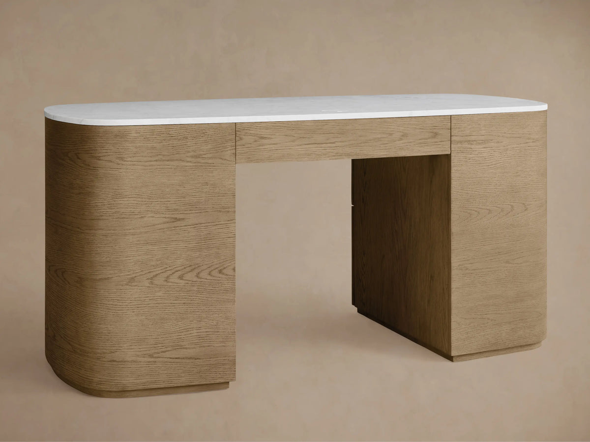 Close-up of the Danny Executive Desk, showing a partially open oak veneer drawer with a gold pull handle and white Carrara marble top.