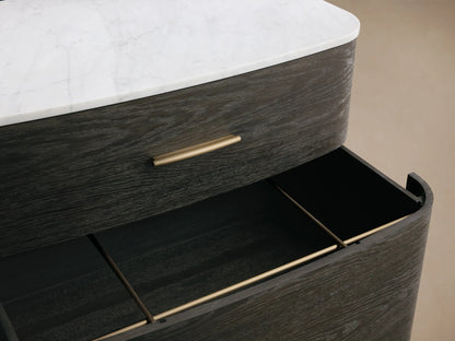 Front view of a dark wood two-drawer nightstand with rounded corners, white marble top, brass pulls, and tapered legs.