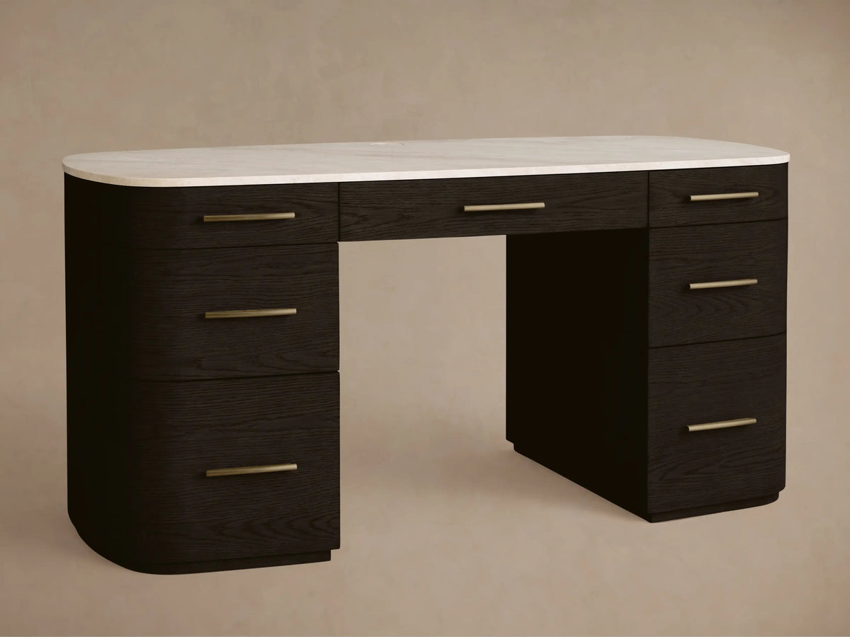 Danny Executive Desk: Dark ebony oak veneer, rounded, white Carrara marble top, 7 drawers with brass handles, front view.