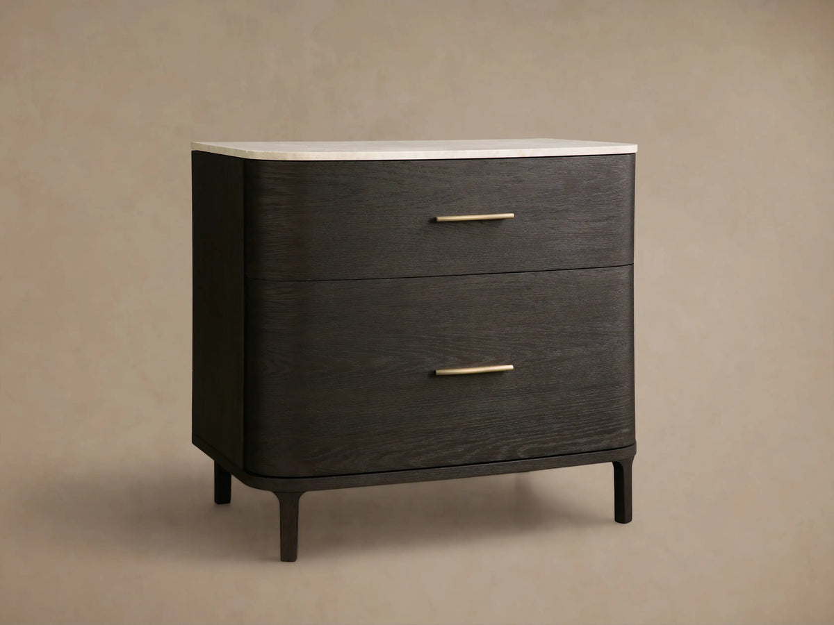 Front view of the dark oak veneer Danny File Cabinet with rounded edges, two drawers, brass hardware, and white Carrara marble top.