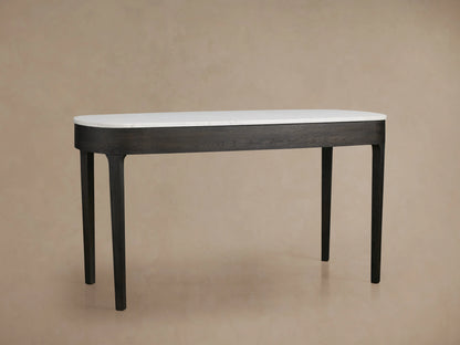 Danny Writing Desk, top-down view. Elongated white Carrara marble top with natural veining and rounded corners on a beige background.