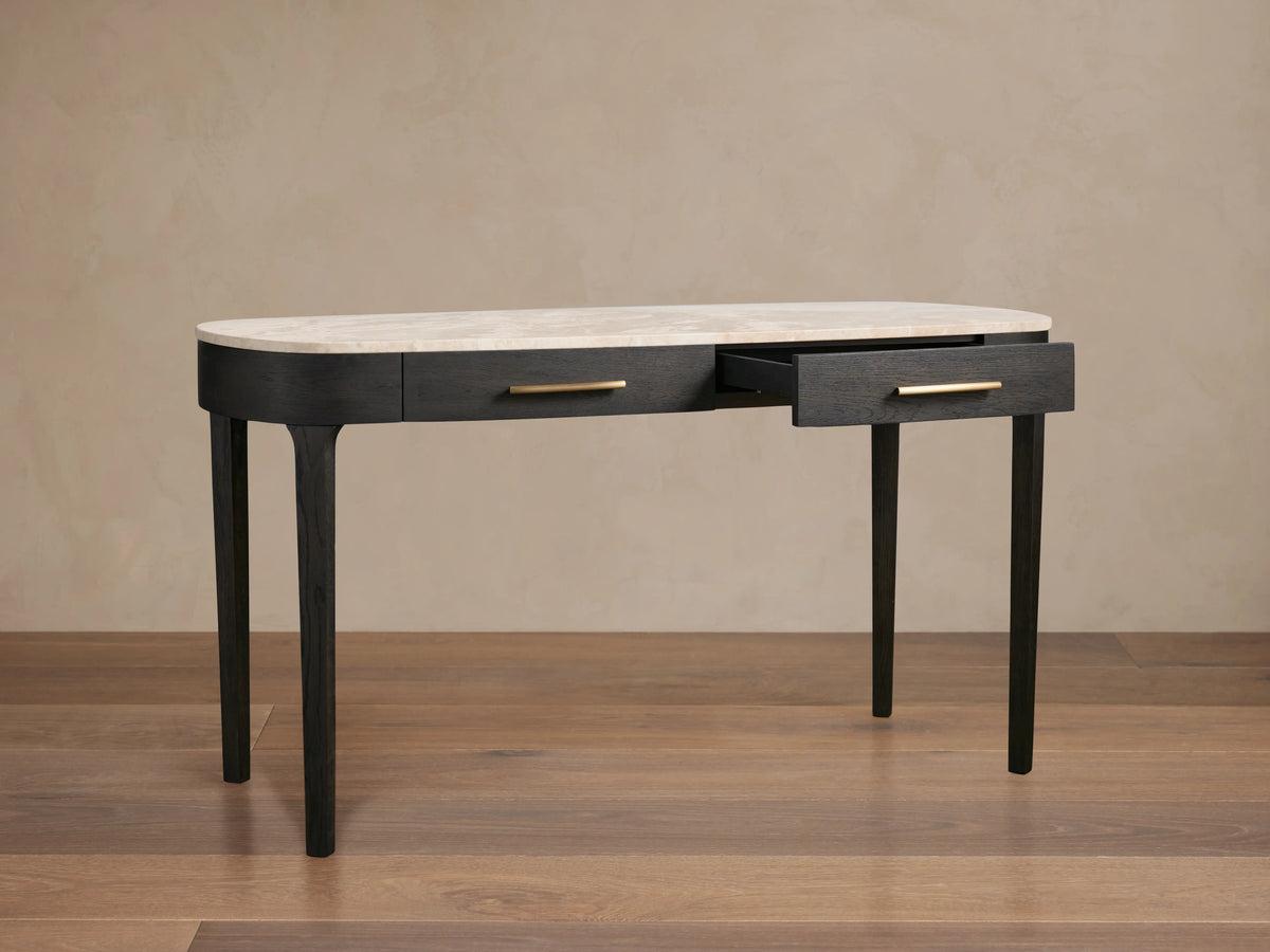Danny Writing Desk, ebony wood base, elliptical royal cream marble top. One drawer open with brass hardware.