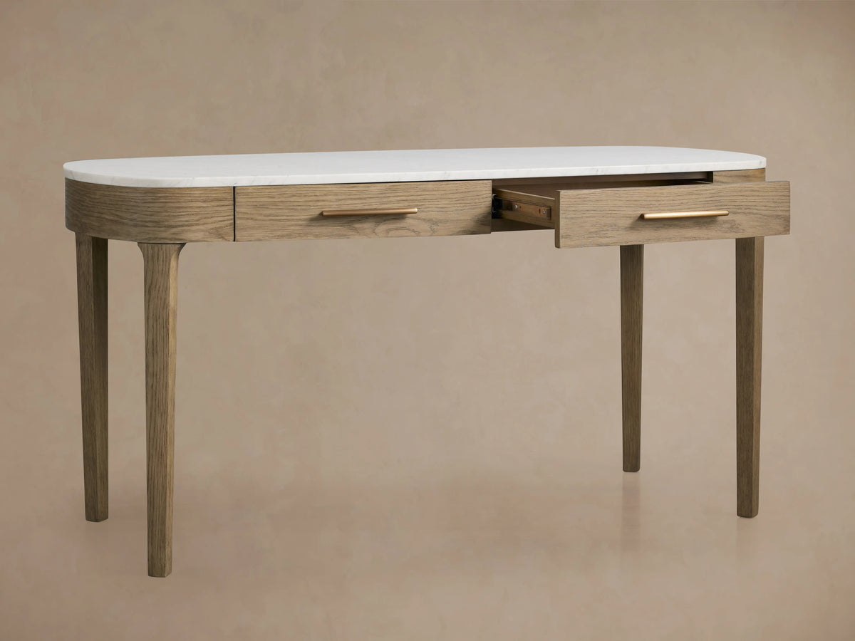 Danny Writing Desk: Oval white marble top on a fawn oak wood base with two subtly defined drawers and slender legs.