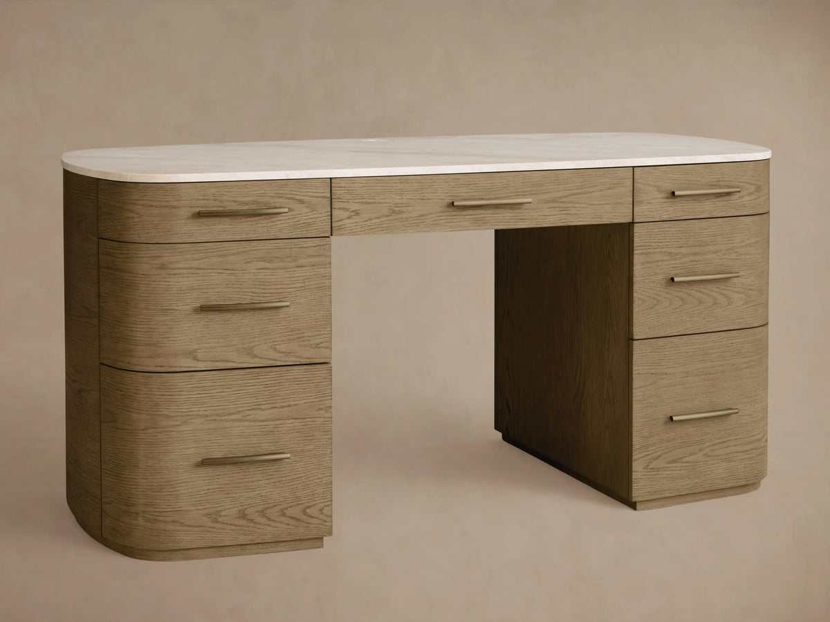 Front view of Danny Executive Desk. White Carrara marble top on a fawn oak veneer base with 7 drawers & brass handles.