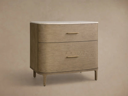 Front view of the Danny File Cabinet, featuring light oak veneer, two curved drawers with brass pulls, and a white marble top.