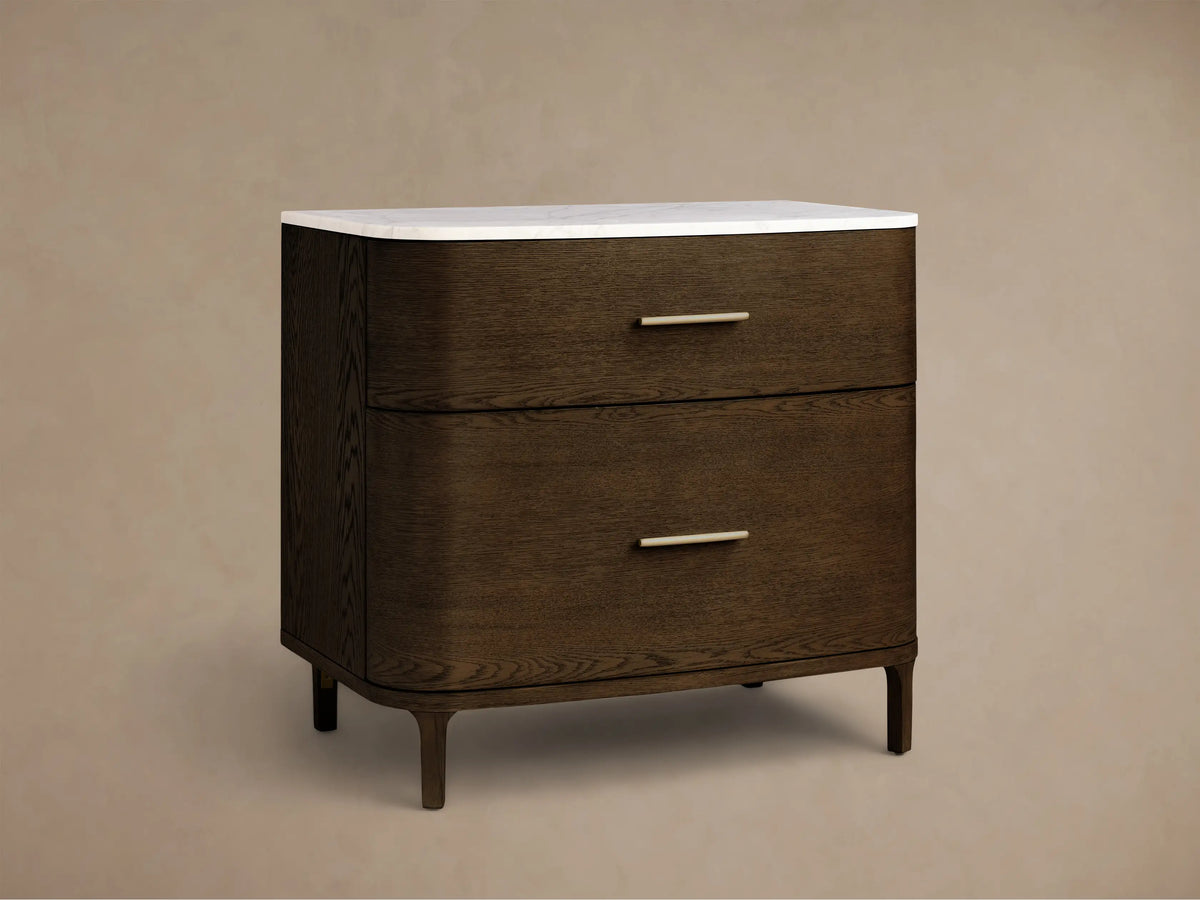Front view of the dark brown Danny File Cabinet™ with two drawers, brass handles, rounded edges, and a white marble top.