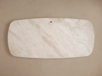 Top-down view of the earth-toned royal cream marble Danny Executive Desk, featuring natural veining and a central cord management grommet.