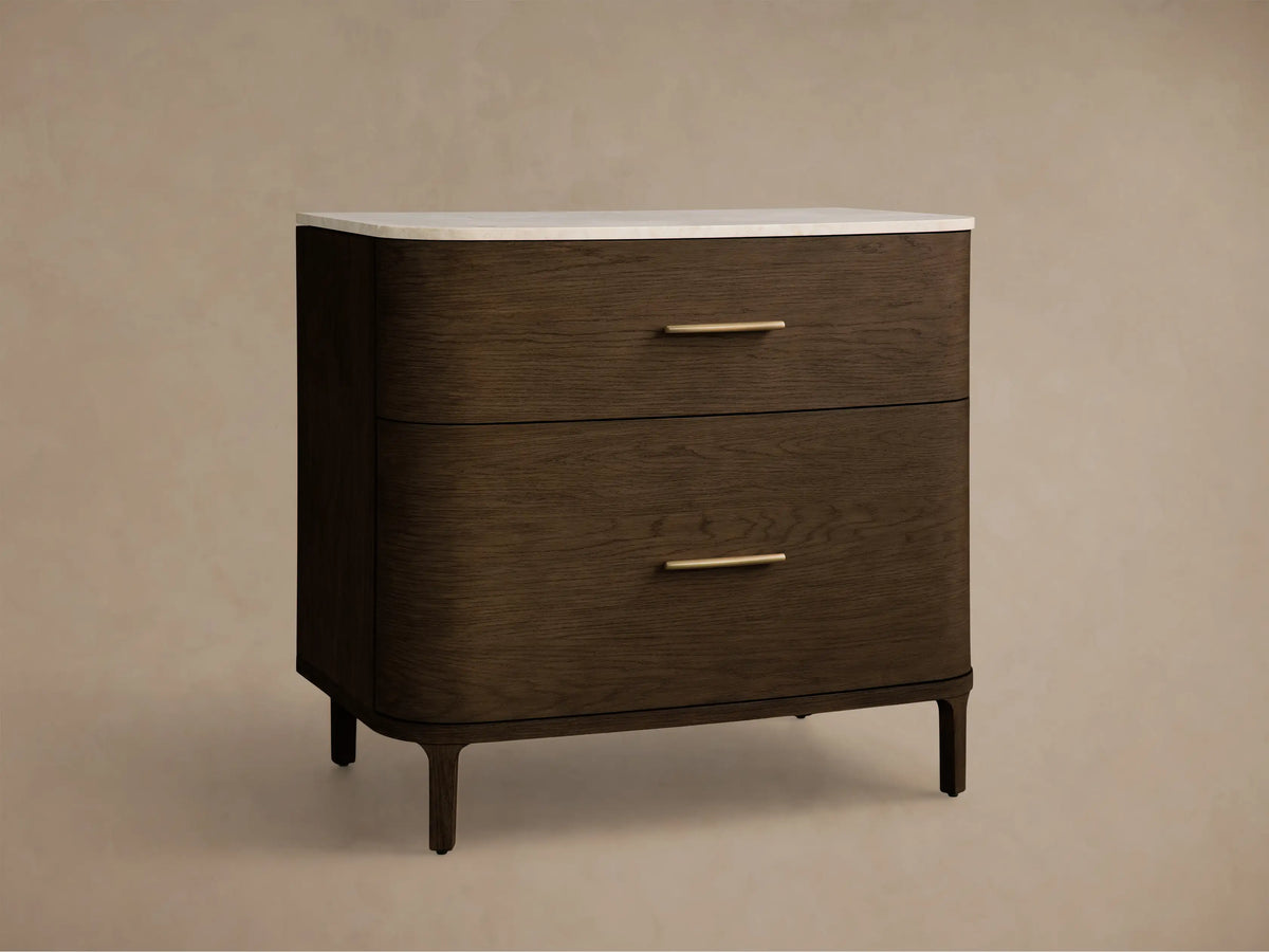 Front view of the Danny File Cabinet, featuring a white marble top, dark brown wood body, two drawers with brass handles, and rounded corners.