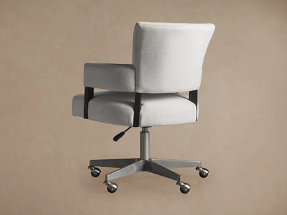 Fallyn Desk Chair in light fabric with padded armrests, cushioned seat, and backrest on a metal swivel base with casters.
