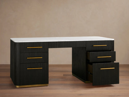 Finnley Executive Desk with dark wood finish, brass handles, six drawers, and a white surface, set on wood floor.