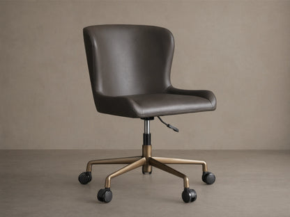 Kirsten Faux Leather Desk Chair with dark brown upholstery, aluminum base, and black casters on wood flooring.