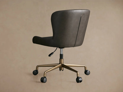 Kirsten Faux Leather Desk Chair in dark brown, featuring a curved back, gold aluminum base with casters, and hydraulic lift handle.