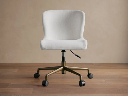 Kirsten Desk Chair with light gray fabric, ergonomic seat design, and black swivel base against a neutral background.