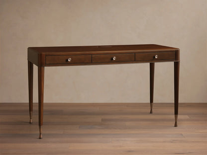 Front view of a rectangular brown wood console table with tapered legs and bronze-toned metal caps on the feet.