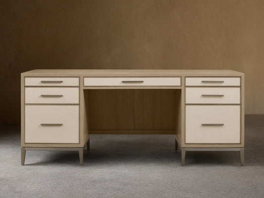 Front view of a Bone Malone Executive Desk with off-white shagreen leather drawer fronts and dark steel legs.