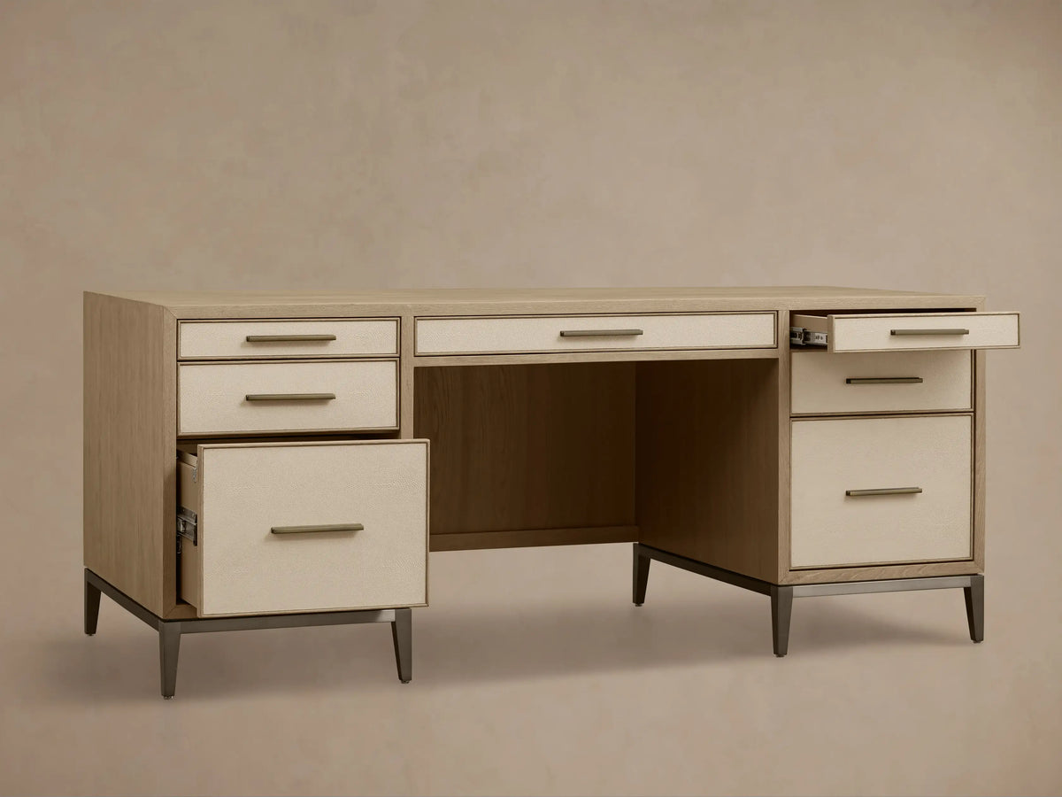 Front view of a Bone Malone Executive Desk with off-white shagreen leather drawer fronts and dark steel legs.