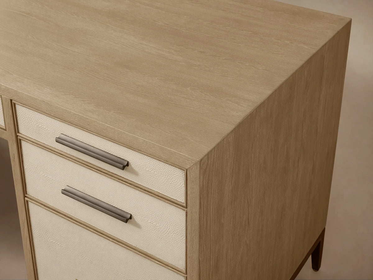 Front view of the Malone Executive Desk in light wood with Bone leather drawer insets, dark metal legs. Bottom left and top right drawers open.