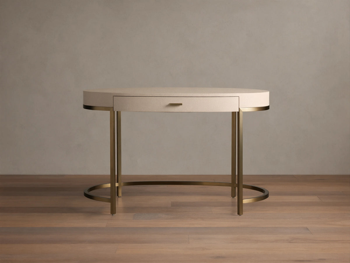 Front view of the Flemish Natural Malone Writing Desk with shagreen-textured top, single drawer, and warm brass metal legs.