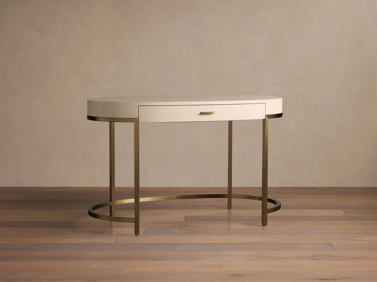 Front view of the Flemish Natural Malone Writing Desk with shagreen-textured top, single drawer, and warm brass metal legs.