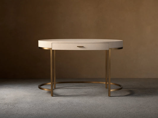 Front view of the Flemish Natural Malone Writing Desk with shagreen-textured top, single drawer, and warm brass metal legs.