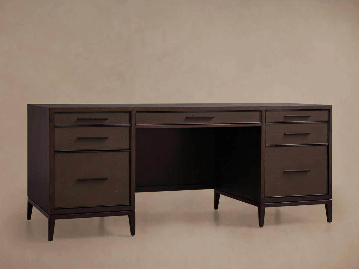 Malone Executive Desk with dark wood finish, five drawers, and steel bases in warm brass. Shagreen-detailed leather insets.