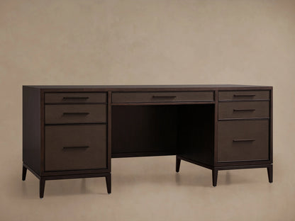 Malone Executive Desk with dark wood finish, five drawers, and steel bases in warm brass. Shagreen-detailed leather insets.