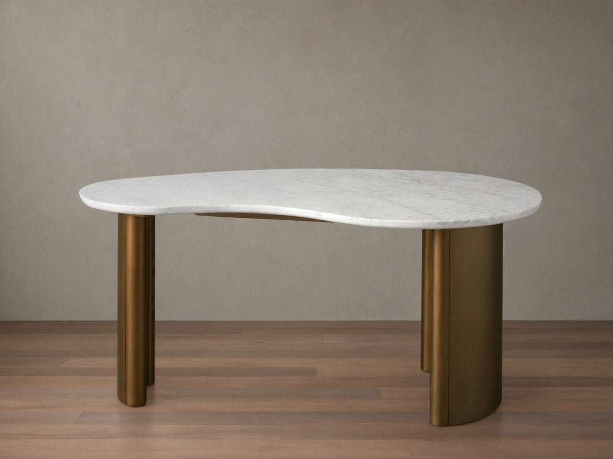 Marlie Writing Desk with a kidney-shaped white marble top and rounded edges sits on rubberwood bases with an antique copper finish.