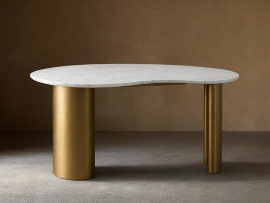 Marlie Writing Desk with a kidney-shaped white marble top and rounded edges sits on rubberwood bases with an antique copper finish.