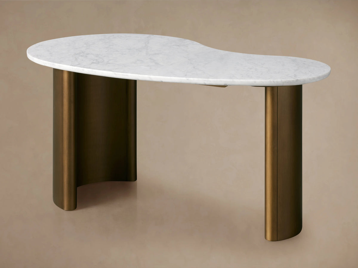 Kidney-shaped white marble top with rounded edges, featuring natural veining and variations on a neutral background.