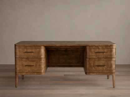 Front view of the Mogadore Executive Desk, crafted from brown mappa burl wood with four drawers and antique brass handles.