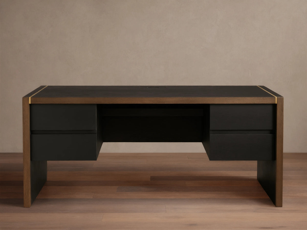 Mihaela Executive Desk in dark wood with gold trim, featuring four drawers and a sleek, modern design on a wooden floor.